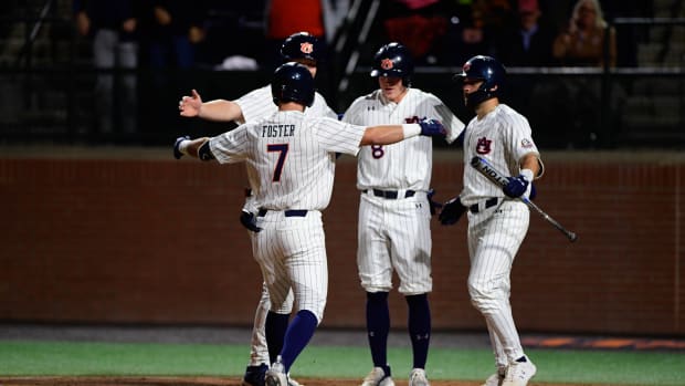 Auburn baseball celebrates after a Cole Foster home run against Alabama State.